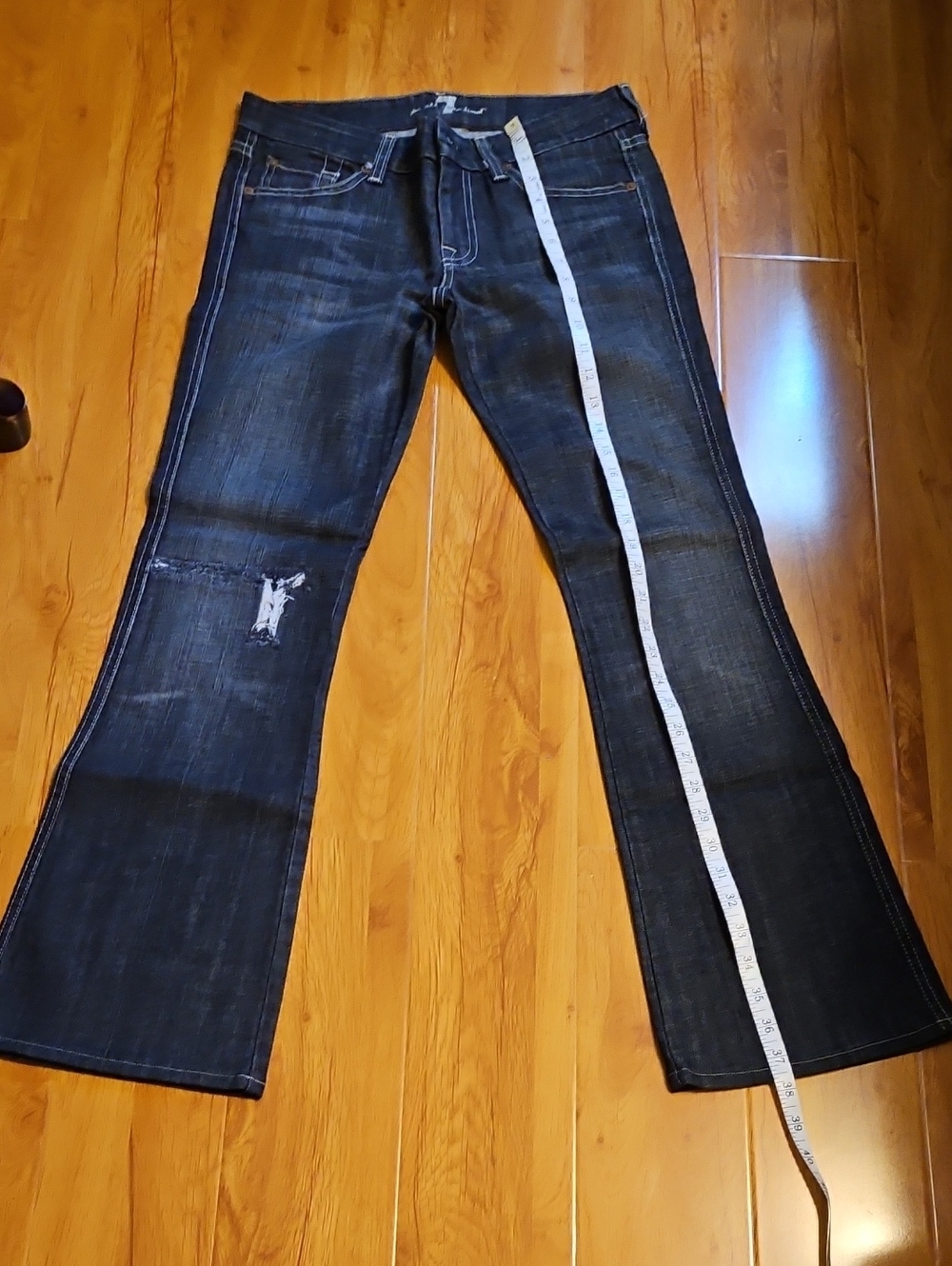 7 For All Mankind Dark Blue Flared Jeans with Distressed Knee